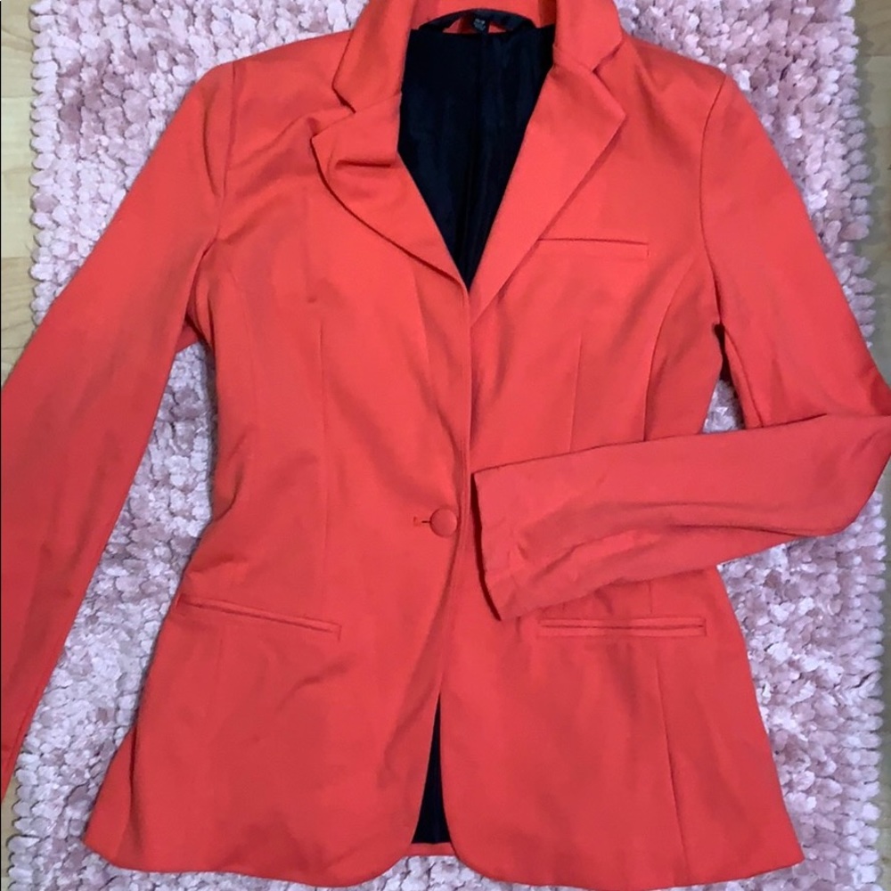 Peach blazer.